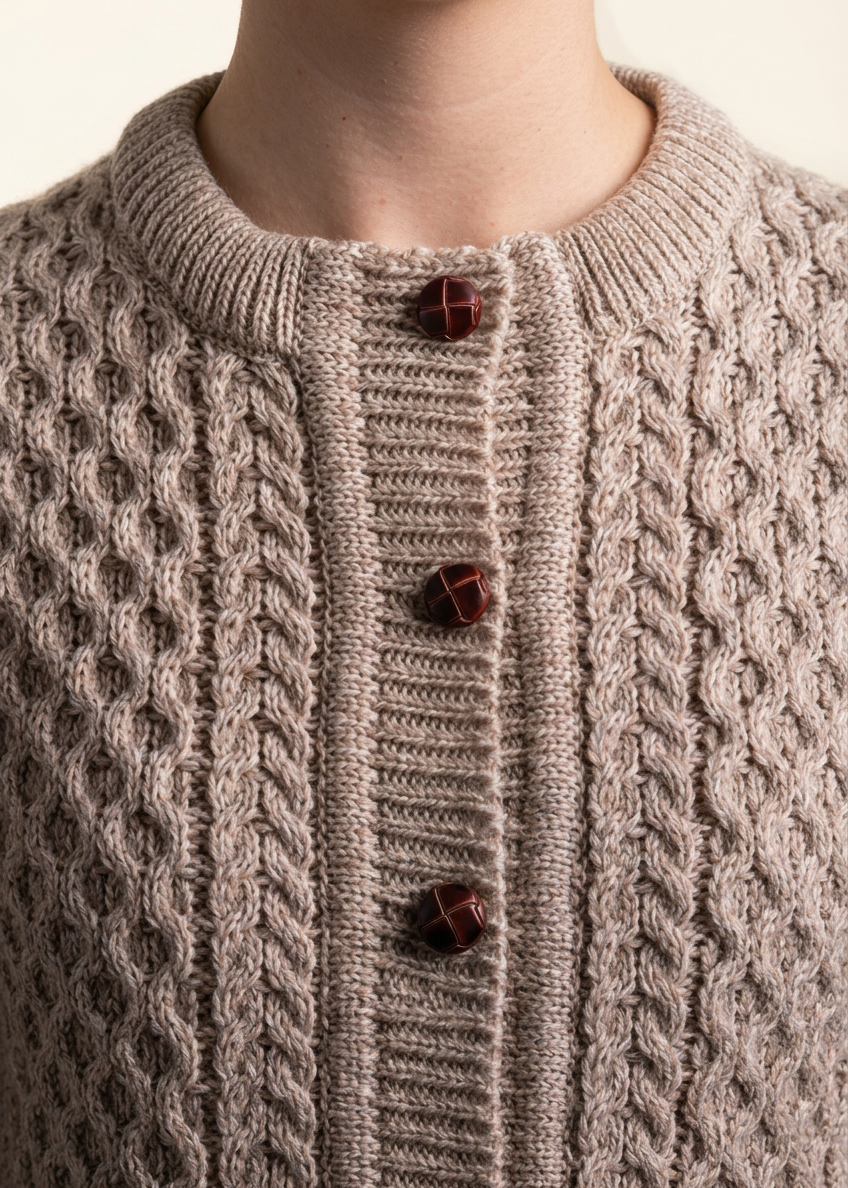 Oatmeal cardigan collar and button close-up