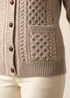Oatmeal cardigan pocket and hem detail