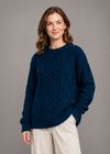 Oversized navy sweater, angled standing pose