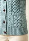Pale-aqua cardigan pocket and hem close-up