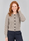 Relaxed studio pose with hand touching hair