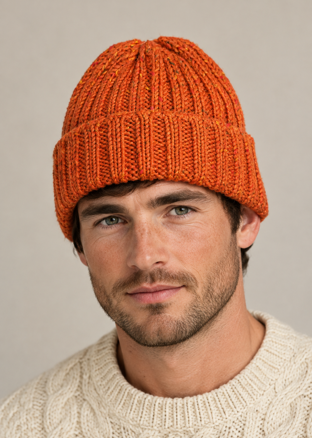 Rust orange Hill Walker Hat on a male model, head and shoulders