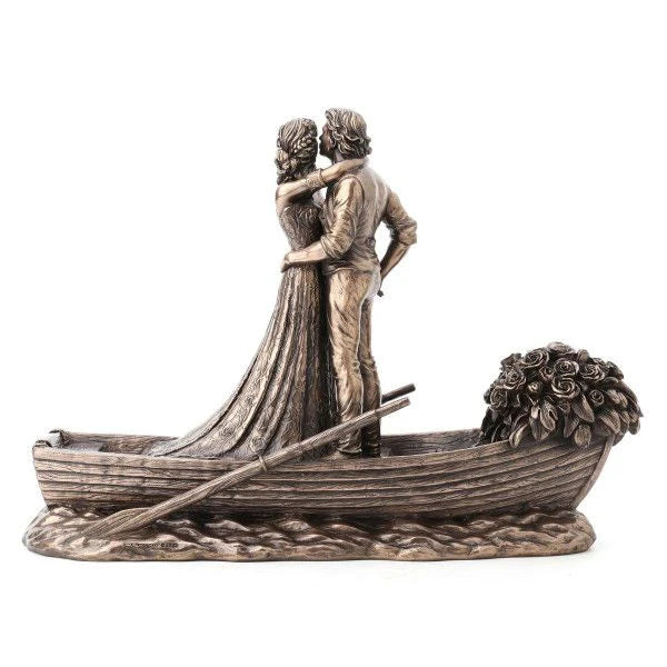 Statue of a couple in a boat with a white background