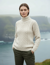 White Aran sweater coastal cliffs